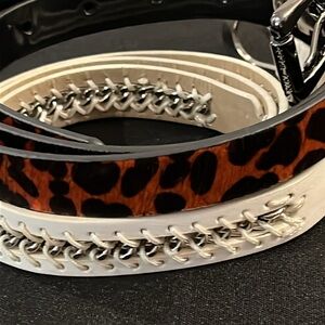 Nine West Ladies Belt. Genuine dyed cow hair with gun metal. One white & silver